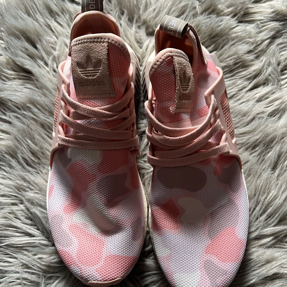 Womens Adidas NMD pink camouflage sneakers.